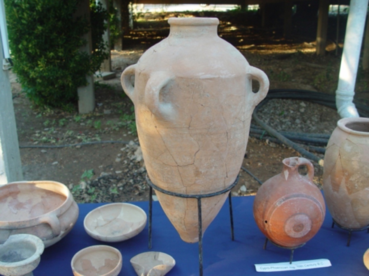 Image 3: A typical storage jar with three handles on it.